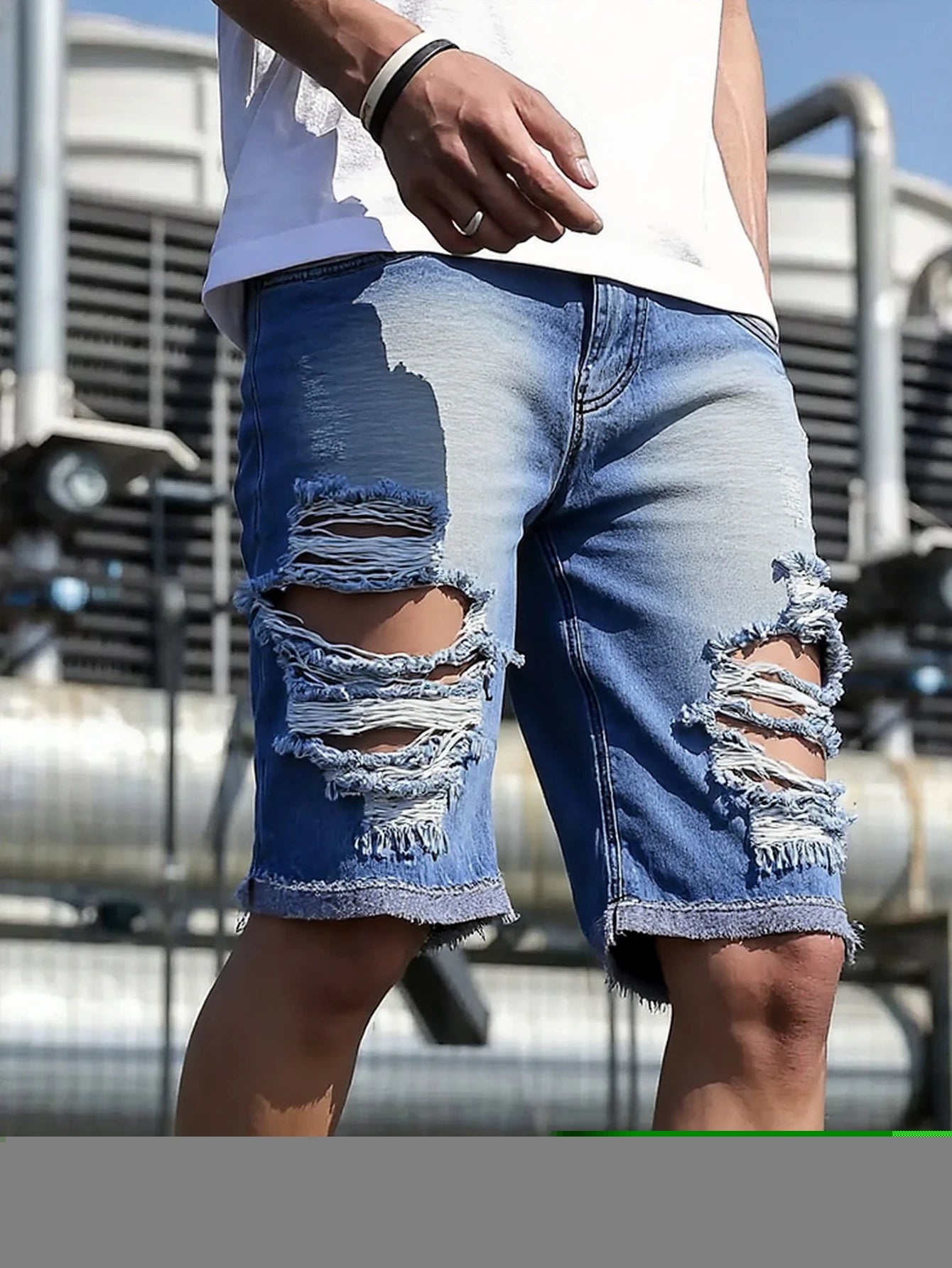 Men's light blue distressed denim shorts, featuring unique frayed edges, trendy and eye-catching, effortlessly creating a street