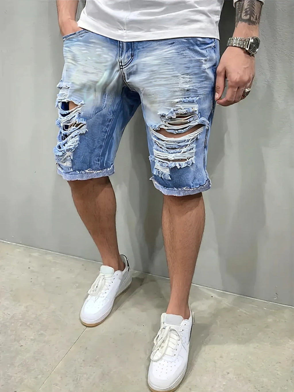Men's light blue distressed denim shorts, featuring unique frayed edges, trendy and eye-catching, effortlessly creating a street